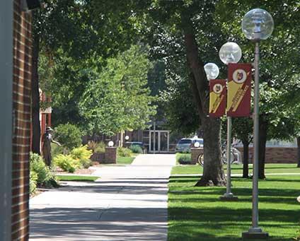A sidewalk on the campus green