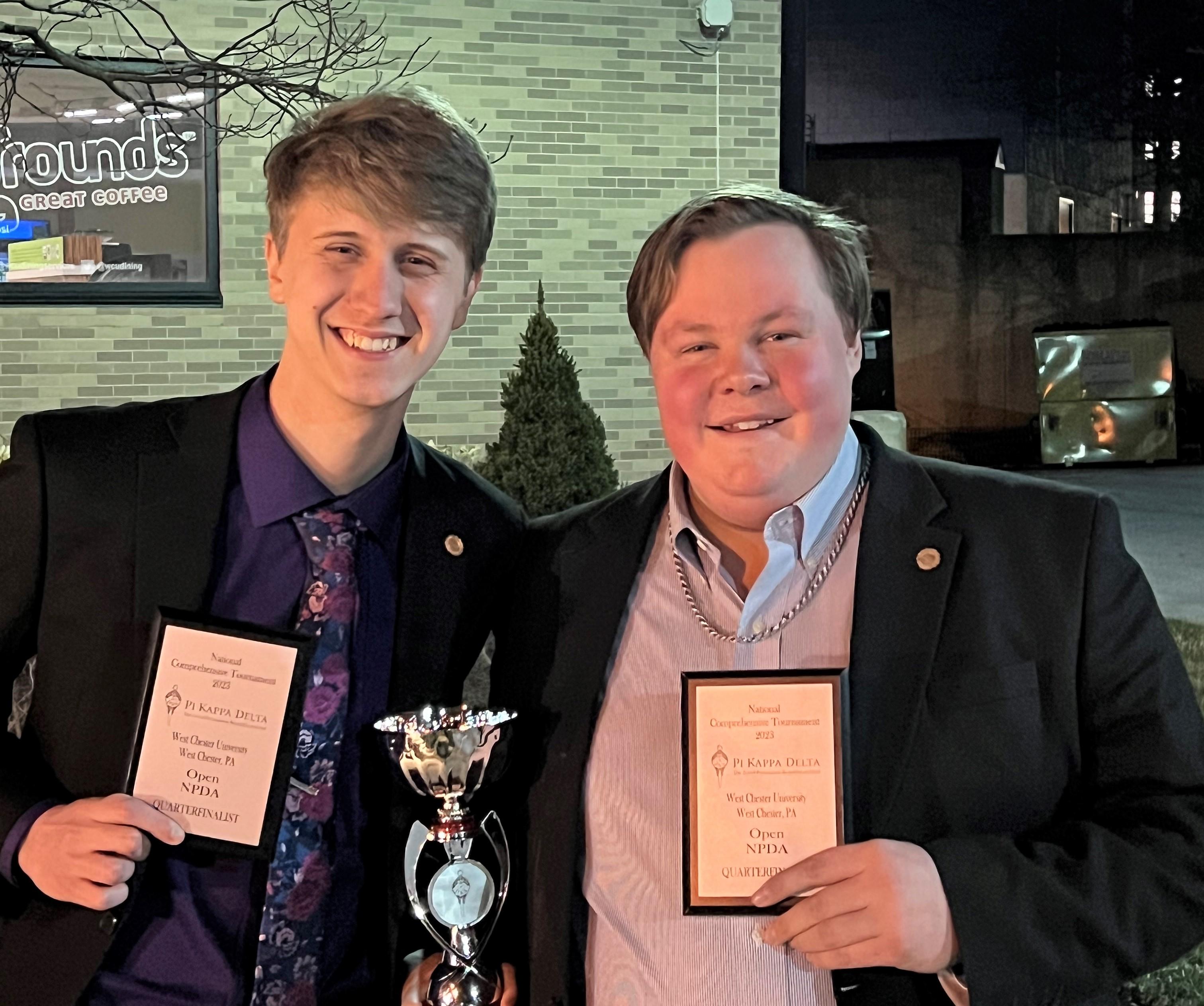 Ethan Kurtz and Jacob Swanson with their 2023 Speech and Debate awards and trophy